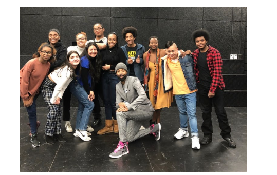Pictured: CRLS theater students with alum Keith Mascoll (center) in the black box theater.