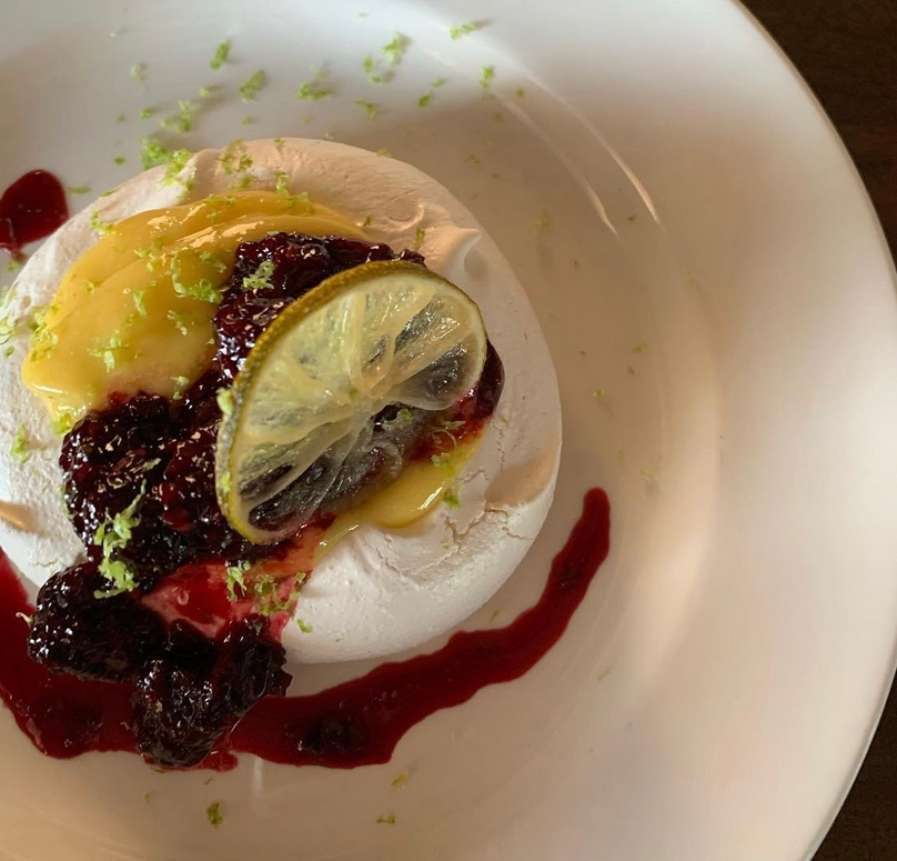 Pavlova with lime curd and blackberry jam