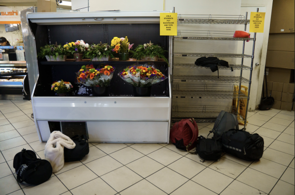 Students are required to leave their backpacks on a metal shelf by the entrance.