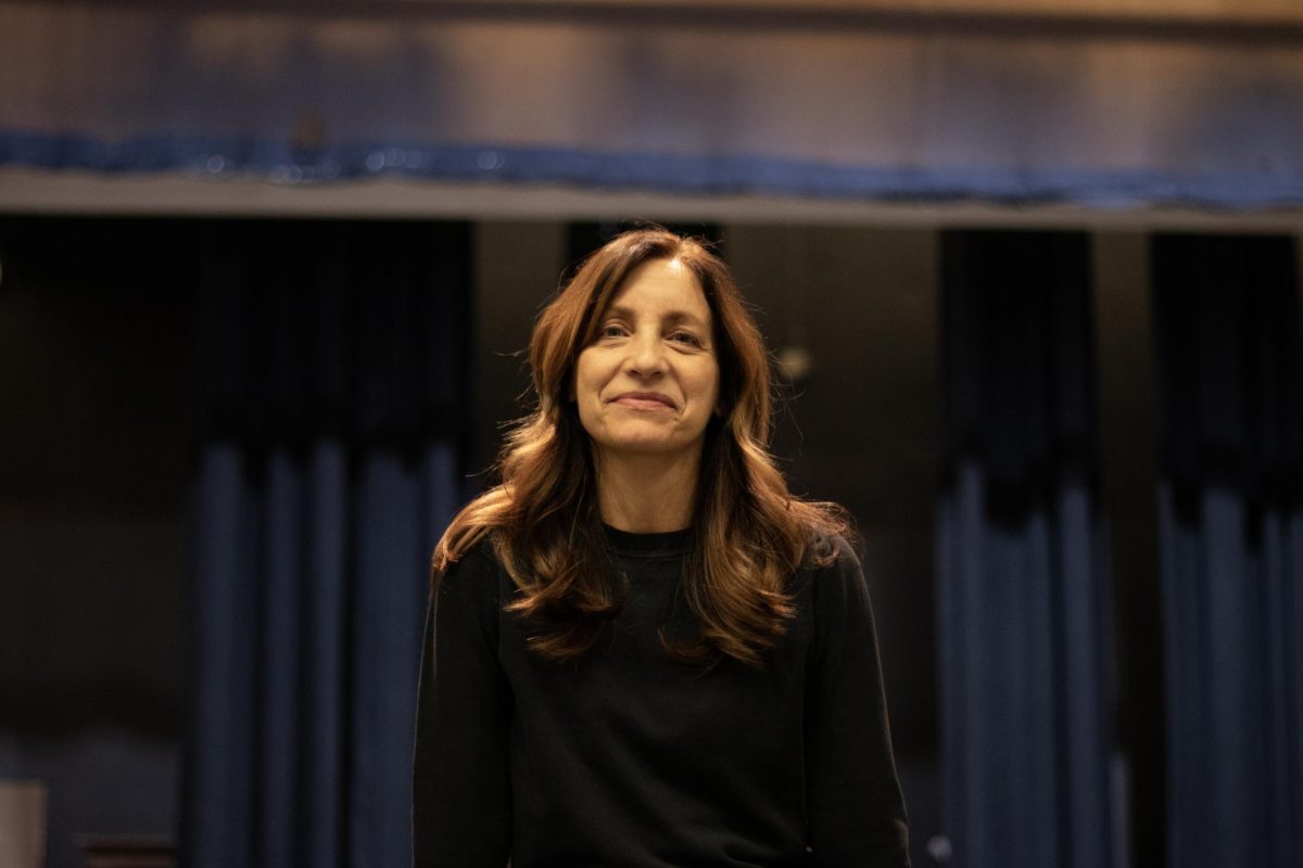 Ms. D both teaches dance classes and runs CRLS' Modern Dance Company. 